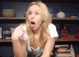 Celebrity gif. Actor Kristen Bell dramatically gestures to the back of her throat and mimics gagging. 