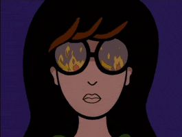 Cartoon gif. Cartoon character Daria’s round glasses reflect raging flames. She has a blank, yet intimidating expression on her face. 