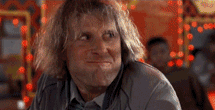 Movie gif. Actors Jeff Daniels and Jim Carrey in Dumb and Dumber exchange looks over a meal before erupting into exaggerated laughter. 