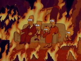 The Simpsons gif. The Whole Simpson’s family sits in their house on their couch very still. Flames roar around them and engulf their house.