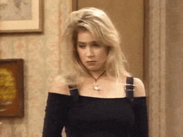 TV gif. Christina Applegate as Kelly in Married... With Children, tilts her head and pouts like she's pleading for something.