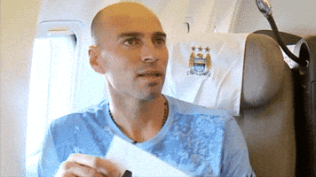 Sports gif. Willy Caballero tilts his head with a shrug face as he touches a sign to his chest that says, "Me." 