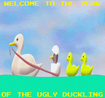 Digital art gif. Mother duck pulls a boat full of her chicklings. One of the chicks is a black duck and the eggshell is still on its head. The text reads, "Welcome to the year of the ugly duckling."