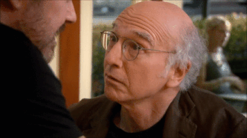 TV gif. Larry David as Larry in Curb Your Enthusiasm nods and smirks up at a man as he slowly backs away. Text, "okay."