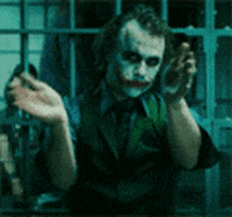 Movie gif. Heath Ledger as The Joker in The Dark Knight claps slowly as he looks eerily out of the corners of his eyes.