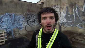 Music video gif. Flight of the Conchords members Bret McKenzie and Jemaine Clement dance and say, "Be more constructive with your feedback." They exclaim at us while jumping around behind a building, "Please. Why? Why? Why? Why? What? Why? Why, exactly? What, exactly?"