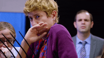 TV gif. Woman on Adam Ruins Everything reacts to something in deep disgust, covering her mouth and holding her chest to keep from gagging.
