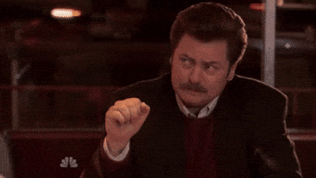 Text gif. Nick Offerman as Ron Swanson from Parks and Rec crumples his brow and holds his fist up, shaking it subtly in an emotional way.
