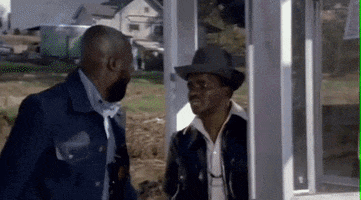 Movie gif. Isaac Hayes as Mac Turner in Truck Turner kicks a man through a glass telephone booth. The man tumbles through the glass and lands on his back on the ground. 