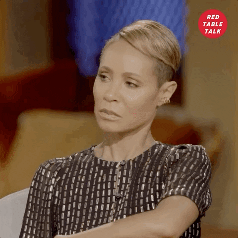 TV gif. Jada Pinkett as host of Red Table Talk leans back as she breathes in and says, "Oh."