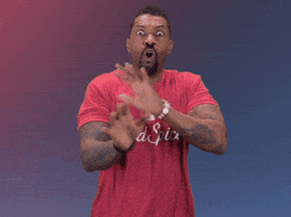 Celebrity gif. Donning a red Old Spice t-shirt, comedian Deon Cole shakes his hands and head wildly while frantically saying, "no, no, no" with wide eyes.