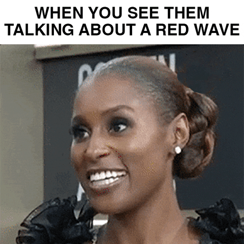 Celebrity gif. Issa Rae on the red carpet at the 2018 Golden Globes throws her head back in uproarious laughter. Text, "When you see them talking about a red wave."