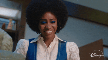TV gif. Teyonah Parris as Monica in Wandavision. She sees something that makes her gasp in pleasure, holding both hands at her chest in surprise. A wide smile warms her face and she looks incredibly touched. 
