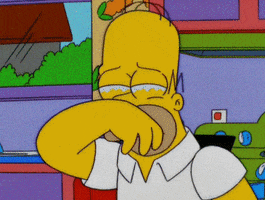 The Simpsons gif. Homer holds a hand over his face and tears well under his eyes as he sobs. 