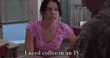 TV gif. Lauren Graham as Lorelai Gilmore from Gilmore Girls slaps her arm as she plainly tells someone in the foreground: Text, "I need coffee in an IV."