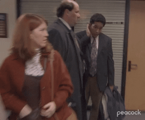 Watching Through Blins - The Office GIF