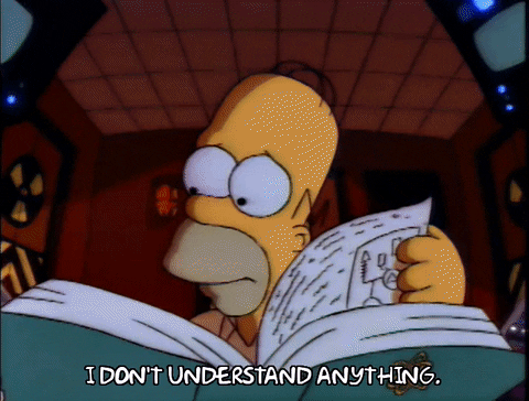 The Simpsons gif. Homer hovers over a big manual book in a room with a hazard sign on the door and high tech monitors. He has a worried expression as he turns the page. He says, “I don't understand anything.”
