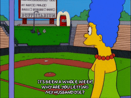 marge simpson pointing toward sign GIF