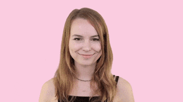 Celebrity gif. Bridgit Mendler smiles and puts a hand up, then gives herself a high five.