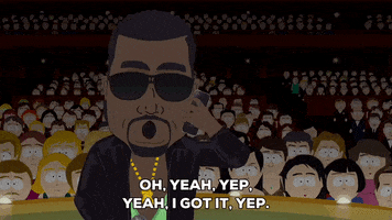 South Park gif. Kanye West stands on stage with a leather jacket and black shades, looking all tough while he speaks into the phone, saying, "Oh, yeah, yep, yeah, I got it, yep. Yep, let me tell 'em. Love you too" and giving a kiss to the person he's calling.
