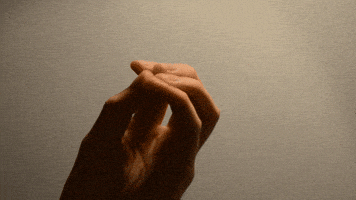 Video gif. Hand with fingers closed to a point expands to reveal a digitally animated translucent geometric webbing connecting the fingers, which waggle and then close again.