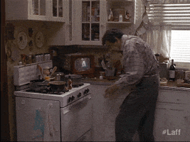 Movie gif. Walter Matthau as Max on Grumpy Old Men opens an oven and discovers a fire inside, then scurries off.
