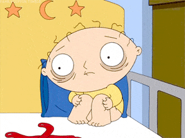 Cartoon gif. Stewie from Family Guy sits in the corner of his crib and rocks back and forth. His eyes have dark circles and bags under them, and his hair is scraggly. He stares into space like he’s seen something awful.