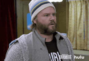 TV gif. Tyler Labine as Kevin Pacalioglu in Deadbeat puts his hands together like he’s praying in shock, his expression slightly worried.