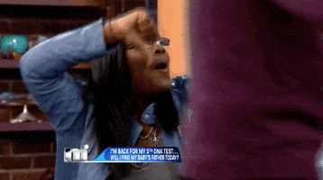 Reality TV gif. A guest on the Maury Show gives a thumbs down, frantically shaking her arm up and down, saying “Boo!”
