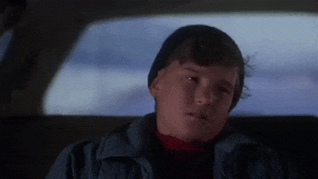Movie gif. Johnny Galecki as Russel in National Lampoon's Christmas Vacation rolls his eyes exasperatedly and tilts his head back over the backseat of a car.
