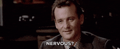 Movie gif. Bill Murray as Dr Peter Venkman in Ghostbusters raises his eyebrows, smiles slightly, and asks, "Nervous?"