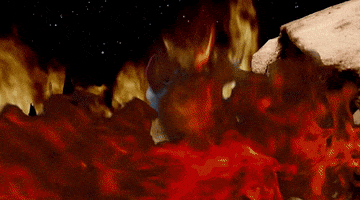 Stop motion gif. Devil is turned away from us and is looking back at a fire pit. He turns back to us and screams, using his pitchfork to point the way.
