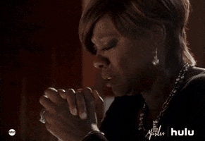 TV gif. Viola Davis as Annalise on How to Get Away With Murder holds her hands together as if she’s praying and looks down with tears streaming from her eyes.