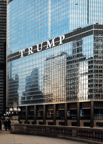 Video gif. One of the Trump Towers’ signs that reads, “Trump” A hand flicks off the T and now it reads, “Rump.”