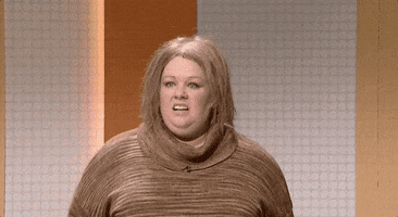 SNL gif. Melissa McCarthy as a game show contestant looks disheveled as she sighs in distress and says, "Yep."