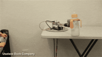smashing robot milk baby GIF