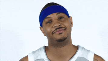 Sports gif. Carmelo Anthony of the New York Knicks smiles disapprovingly and shakes his head like there's no way he's letting you get away with that. 