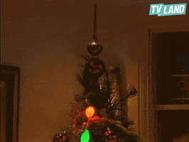 kissing christmas tree GIF by TV Land
