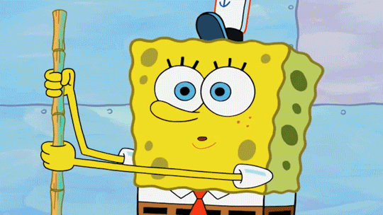 SpongeBob gif. SpongeBob lets go of a bamboo stick that falls to the ground as he lifts both hands to his cheeks and smiles a googly-eyed, buck toothed smile. 