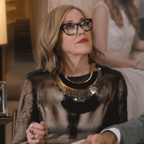 Schitt's Creek gif. Catherine O'Hara as Moira sits up pleased and claps her hands excitedly.
