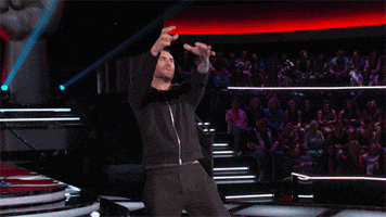 Celebrity gif. An enthusiastic Adam Levine brings his fists down as if to say, “Boom!”