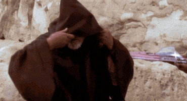 Movie gif. Alec Guinness as Obi Wan Kenobi in Star Wars: A New Hope pulls back the hood of his cloak and gives a nod of recognition. Text, "hello there."