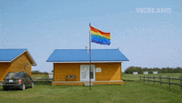 Lgbt Rainbow Flag GIF by GAYCATION with Ellen Page and Ian Daniel