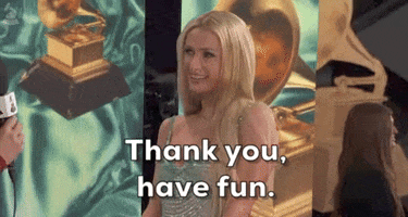 Celebrity gif. Paris Hilton is being interviewed at the Grammys and she has her shoulders raised in an awkward, shy demeanor. She smiles and says, "Thank you, have fun."