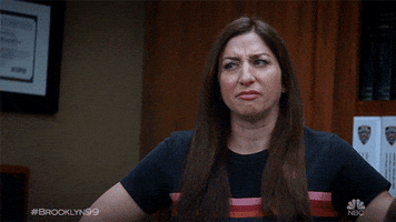 TV gif. Chelsea Peretti as Gina in Brooklyn Nine-Nine grimaces at someone in disgust..