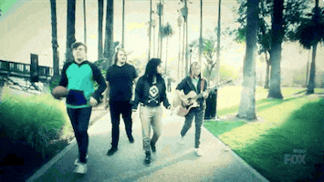 walking playing guitar GIF by American Idol