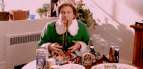 Movie gif. With no need for utensils or napkins, Will Ferrell as Buddy from Elf devours a sugary spaghetti concoction.