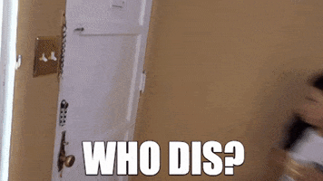 Celebrity gif. Holding a mug, Shalita Grant runs to brace herself against the door of her apartment, looking skeptically and grabbing the doorknob, then jumping aside to reluctantly open the door.