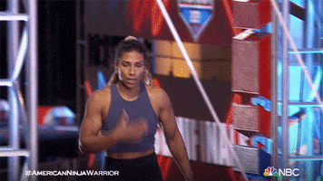 Reality TV gif. Meagan Martin on American Ninja Warrior exhales, pressing her hand to her chest and then waving her hands, like she just accomplished a great feat.