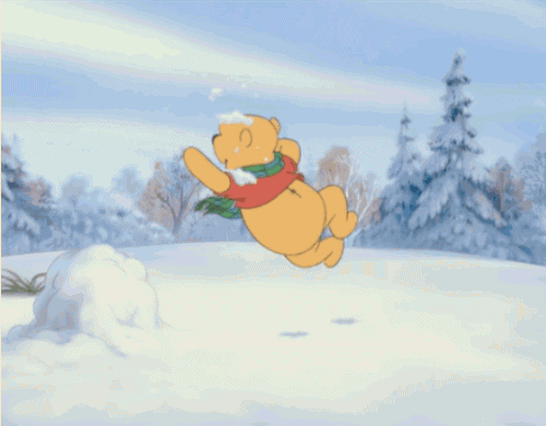 Pooh playing in the snow gif.